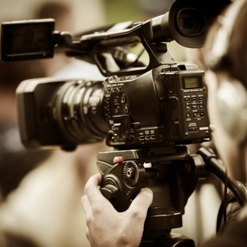 video editing software man shooting filming camera